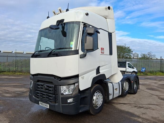 A white Renault T tractor unit with a high sleeper cab